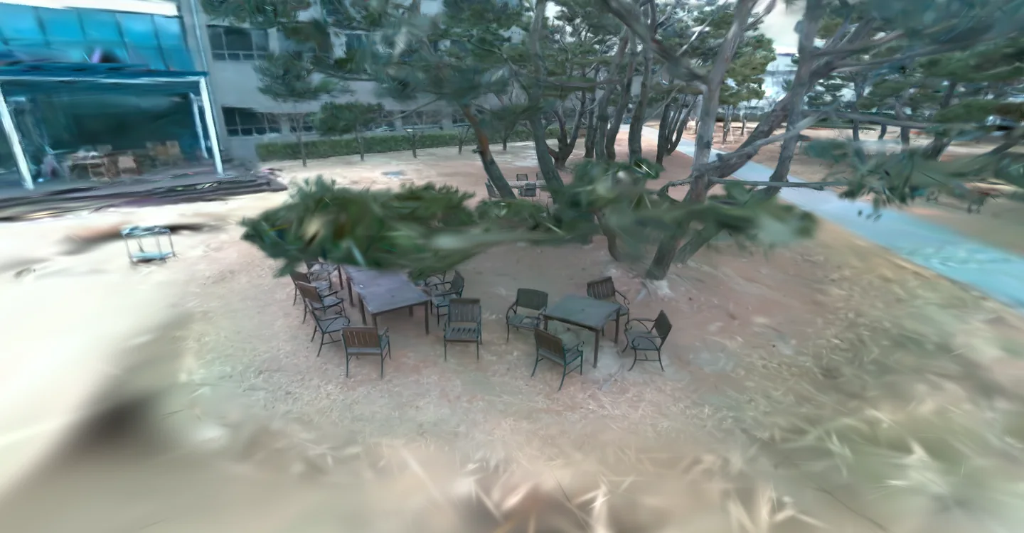 RGB rendering of the reconstructed outdoor courtyard with trees, chairs, and surrounding buildings.